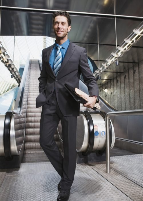 Germany, Bavaria, Munich, Business at subway station, escalator in background